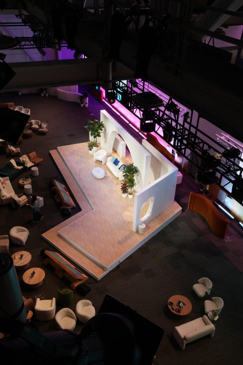 Meta Leadership Day 2025 aerial view of white curved stage platform with archway design and purple lighting