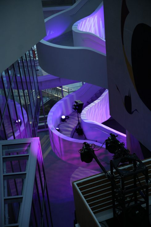 Meta Leadership Day 2025 architectural curved white stairway with purple LED lighting and production equipment