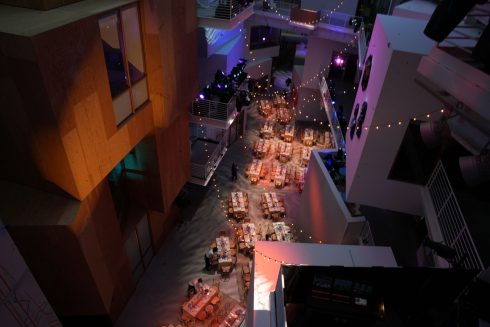 Meta Leadership Day 2025 aerial view of dining area with long tables and decorative string lights throughout multi-level venue