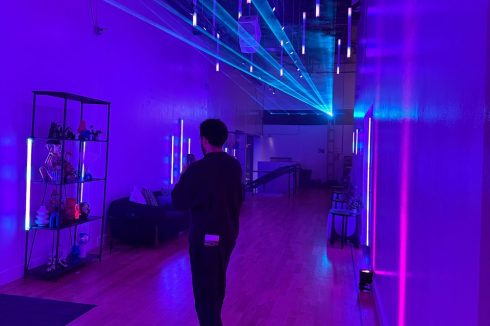 Polychain Investor Day 2025 entrance with immersive purple and blue LED lighting design and ceiling installation