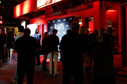 Rao's San Francisco exterior at night with red carpet, step and repeat banner, and crowd of guests during Crucial Catch event