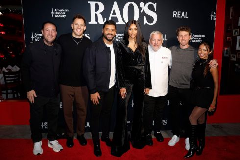 Group photo on red carpet at Rao's Crucial Catch event with American Cancer Society and REAL branding step and repeat